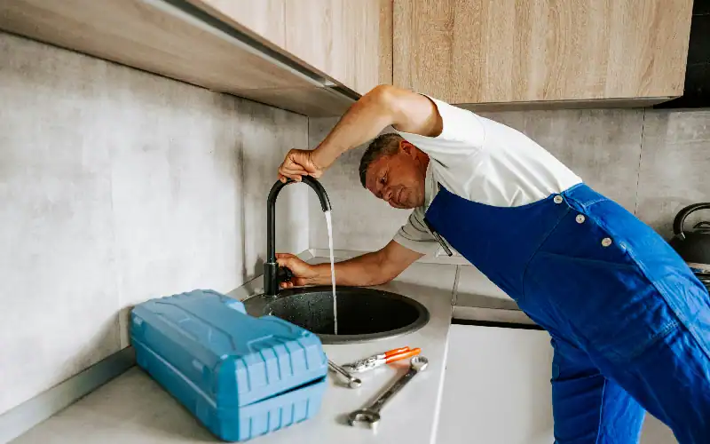 plumber checking tap